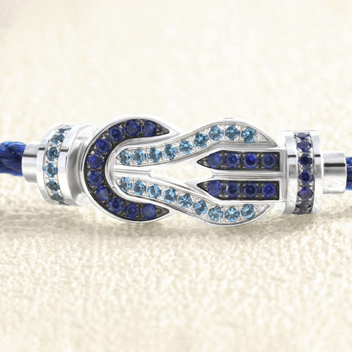 Bracelet Bracelet sur câble FRED Chance Infini MM Or blanc, saphirs, topazes bleues 58 Facettes OC-66000249