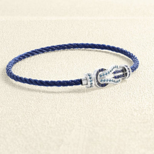 Bracelet Bracelet sur câble FRED Chance Infini MM Or blanc, saphirs, topazes bleues 58 Facettes OC-66000249