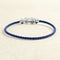 Bracelet Bracelet sur câble FRED Chance Infini MM Or blanc, saphirs, topazes bleues 58 Facettes OC-66000249