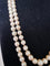 Collier Collier double rang de perles Akoya avec fermoir en or jaune, grenats et diamants 58 Facettes 933