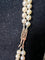 Collier Collier double rang de perles Akoya avec fermoir en or jaune, grenats et diamants 58 Facettes 933