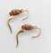 Boucles d'oreilles Dormeuses marguerite antiques en or rose 18k, platine, rubis synthétiques et diamants 58 Facettes A06712
