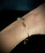 Bracelet Bracelet semi-rigide en or rose et blanc 18 carats serti de 11 diamants 58 Facettes Bracelet 02