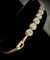 Bracelet Bracelet semi-rigide en or rose et blanc 18 carats serti de 11 diamants 58 Facettes Bracelet 02