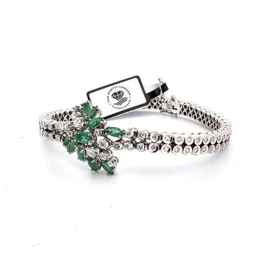 Bracelet Bracelet vintage en or blanc 18 ct avec émeraudes et diamants 58 Facettes 383/A OC