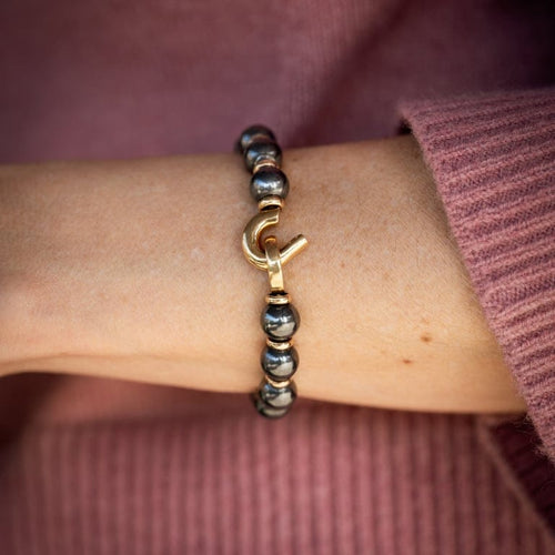Bracelet Cartier - Bracelet perlé en or jaune et hématite 58 Facettes 50222