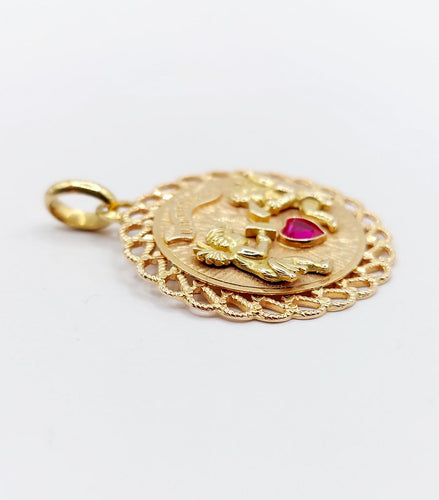 Pendentif Pendentif médaille d’amour en or rose 18k, rubis synthétique 58 Facettes A06908