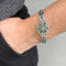 https://api-ledial.emberware.it/app/uploads/2026/03/41153-bracciale-oro-semirigido-diamanti-smeraldi_51b.jpg