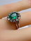 Bague 46 Bague marguerite en or blanc 18 carats, émeraude et diamants 58 Facettes AB693