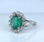 Bague 46 Bague marguerite en or blanc 18 carats, émeraude et diamants 58 Facettes AB693