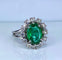 Bague 46 Bague marguerite en or blanc 18 carats, émeraude et diamants 58 Facettes AB693
