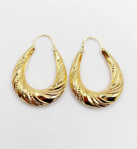 Boucles d'oreilles Créoles XXL vintage à motifs géométriques en or jaune 18k 58 Facettes A06929