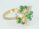Bague Bague entourage en or jaune 18 ct avec diamants et émeraudes 58 Facettes AX01