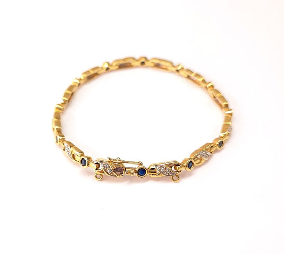 Bracelet Bracelet en or jaune 18K serti de diamants et saphirs 58 Facettes RIV-2129.2