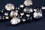 Boucles d'oreilles JOTHI SEROJ - Pendants d’oreilles en or gris et titane, pierres de lune, saphirs et diamants 58 Facettes 227235