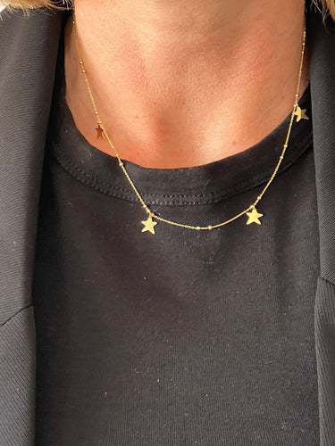 Collier Collier en or jaune 18 carats à pampilles étoiles 58 Facettes 9