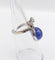 Bague 48 Bague duchesse vintage en or blanc 18k, tanzanite cabochon et diamants 58 Facettes A06916