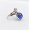 Bague 48 Bague duchesse vintage en or blanc 18k, tanzanite cabochon et diamants 58 Facettes A06916