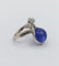 Bague 48 Bague duchesse vintage en or blanc 18k, tanzanite cabochon et diamants 58 Facettes A06916