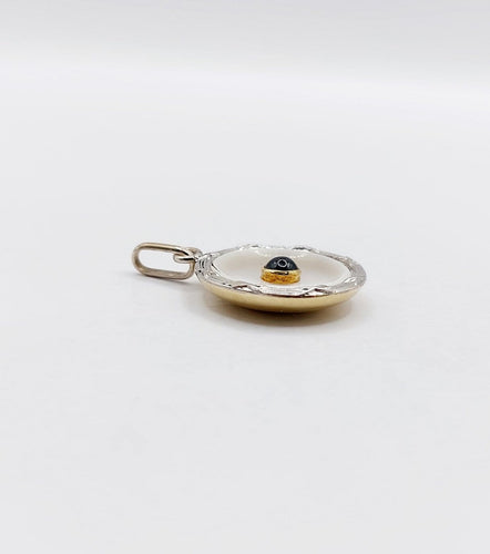 Pendentif Pendentif cible Art déco en or 18k et platine, nacre et saphir 58 Facettes A06912