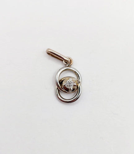 Pendentif Pendentif antique nœud infini en or blanc 18k et diamant (circa 1920) 58 Facettes A06948