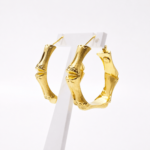 Boucles d'oreilles Boucles d’oreilles créoles maille bambou en or jaune 18 carats 58 Facettes Boucles d'oreilles créoles bambous en or