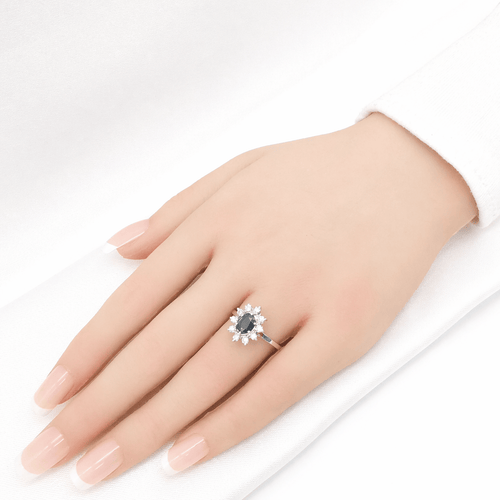 Bague 53 Bague marguerite en or blanc 18 carats, saphir et diamants 58 Facettes Bague marguerite en or saphir et diamants