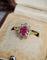 Bague 50 Bague marguerite rubis et diamants en or jaune 18 carats 58 Facettes 723