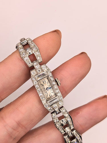 Montre Montre Art déco en or gris 18k et diamants 58 Facettes O817