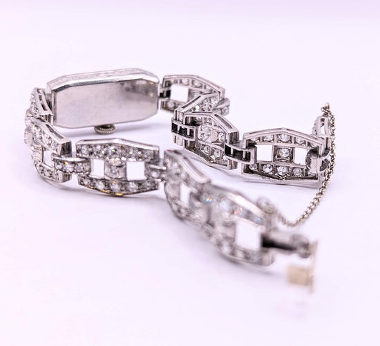 Montre Montre Art déco en or gris 18k et diamants 58 Facettes O817