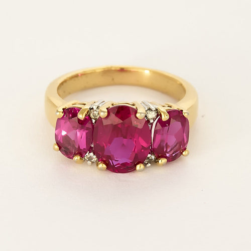Bague 50 Bague jarretière en or jaune et or gris, rubis de synthèse 58 Facettes 260252
