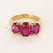 Bague 50 Bague jarretière en or jaune et or gris, rubis de synthèse 58 Facettes 260252