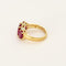 Bague 50 Bague jarretière en or jaune et or gris, rubis de synthèse 58 Facettes 260252