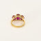 Bague 50 Bague jarretière en or jaune et or gris, rubis de synthèse 58 Facettes 260252