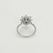 Bague 55 Bague Marguerite en or gris, émeraude et diamants 58 Facettes 260212