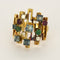 Bague 53 Bague moderniste en or jaune, diamants, rubis, émeraudes et saphirs 58 Facettes B260053