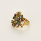 Bague 53 Bague moderniste en or jaune, diamants, rubis, émeraudes et saphirs 58 Facettes B260053