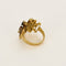 Bague 53 Bague moderniste en or jaune, diamants, rubis, émeraudes et saphirs 58 Facettes B260053