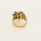 Bague 53 Bague moderniste en or jaune, diamants, rubis, émeraudes et saphirs 58 Facettes B260053