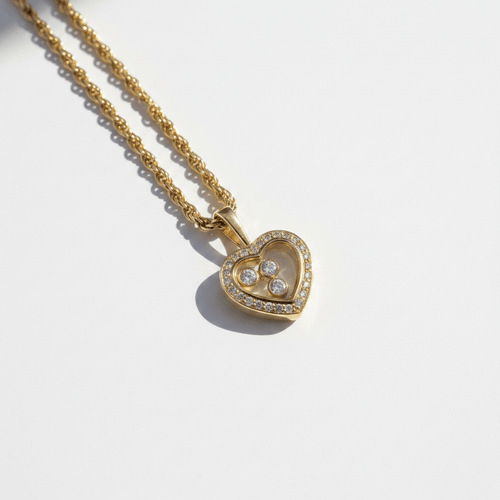 Collier Chopard Happy Diamond - Collier pendentif cœur en or jaune 18 carats et diamants 58 Facettes 1.0001457/1
