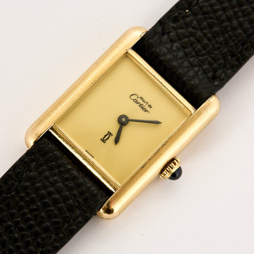 Montre Cartier Tank Must - Montre en argent plaqué or, cadran crème 58 Facettes A1179