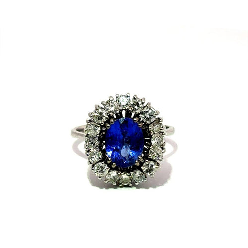 Bague Bague halo en or blanc 18k avec tourmaline bleue et diamants 58 Facettes 50451
