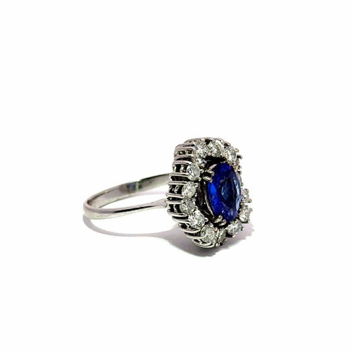 Bague Bague halo en or blanc 18k avec tourmaline bleue et diamants 58 Facettes 50451