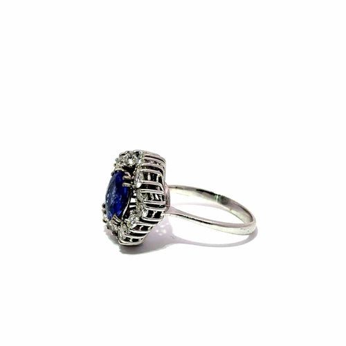 Bague Bague halo en or blanc 18k avec tourmaline bleue et diamants 58 Facettes 50451