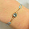 Bracelet Les Petits Acrostiches - Bracelet en or jaune 18k et tourmaline bleu-clair 58 Facettes bracelet-acrostiche-bleu-clair