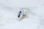 Bague 51 Bague marquise en or jaune 18 kt et platine, saphirs de Ceylan et diamants 58 Facettes