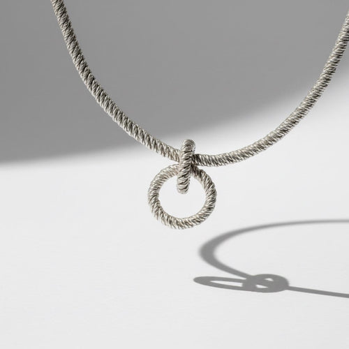 Collier Hermès - Collier vintage en argent à deux anneaux entrelacés 58 Facettes 1.0000900/1