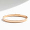 Bracelet Hermès Kelly - Bracelet petit modèle en or rose et diamants 58 Facettes 1.0000733/1