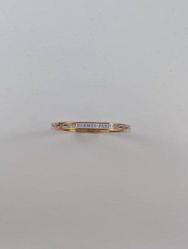 Bracelet Hermès - Bracelet jonc De l'Ombrelle aux Duels en plaqué or rose et émail 58 Facettes 1143