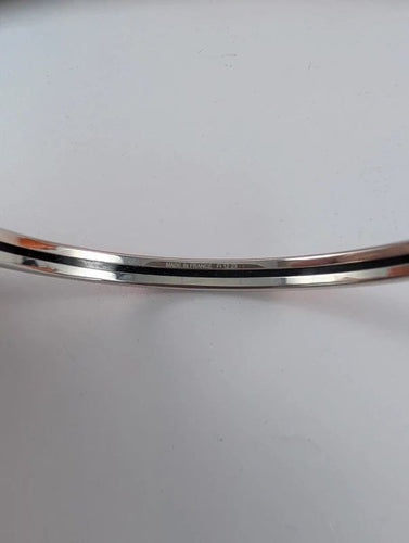 Bracelet Hermès - Bracelet jonc Uni en acier et émail orange 58 Facettes 1141